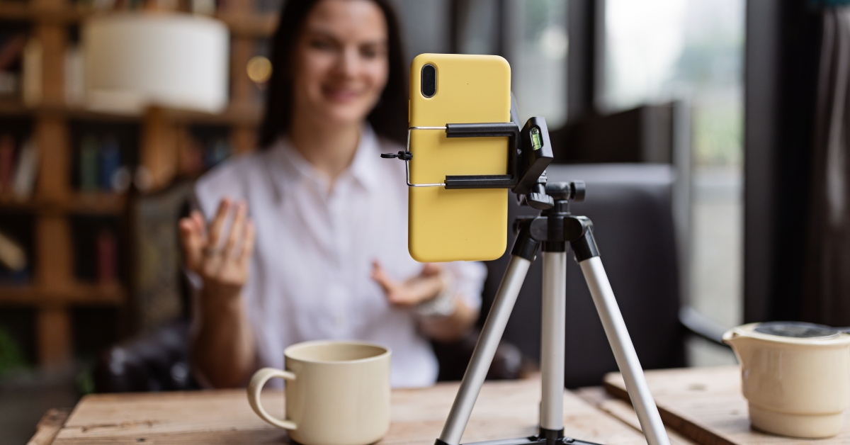 Happy woman streaming with phone