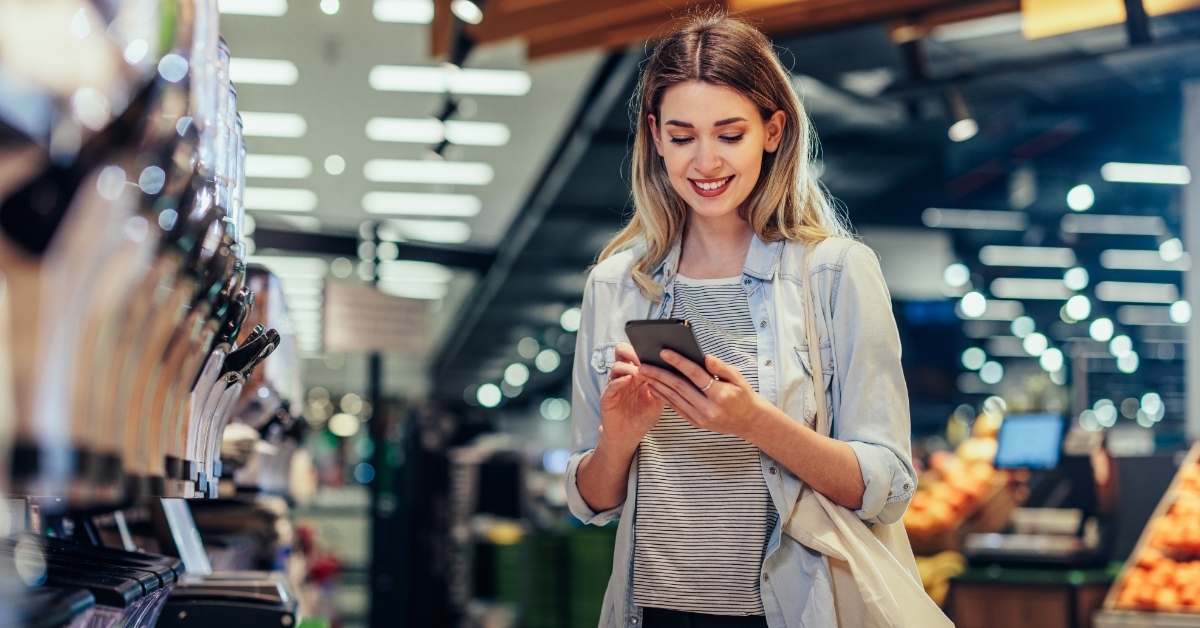 woman reviewing shopping list on smartphone