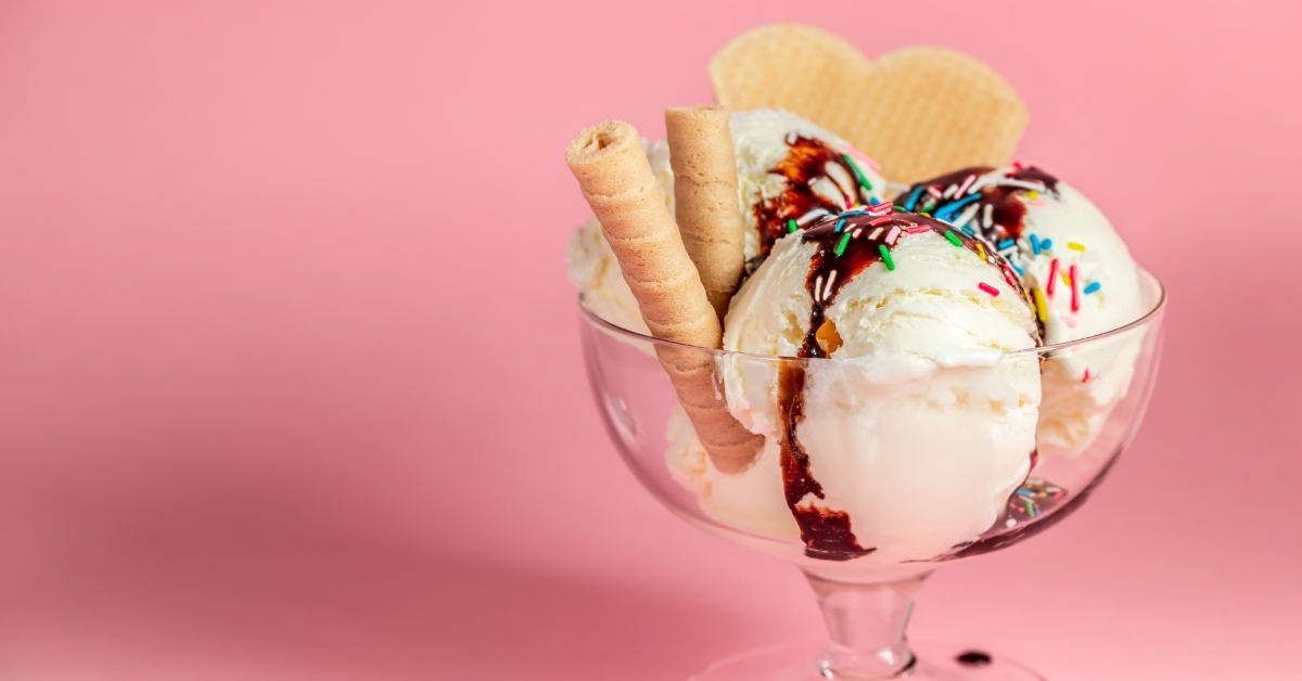 delicious sundae glass bowl on pink background