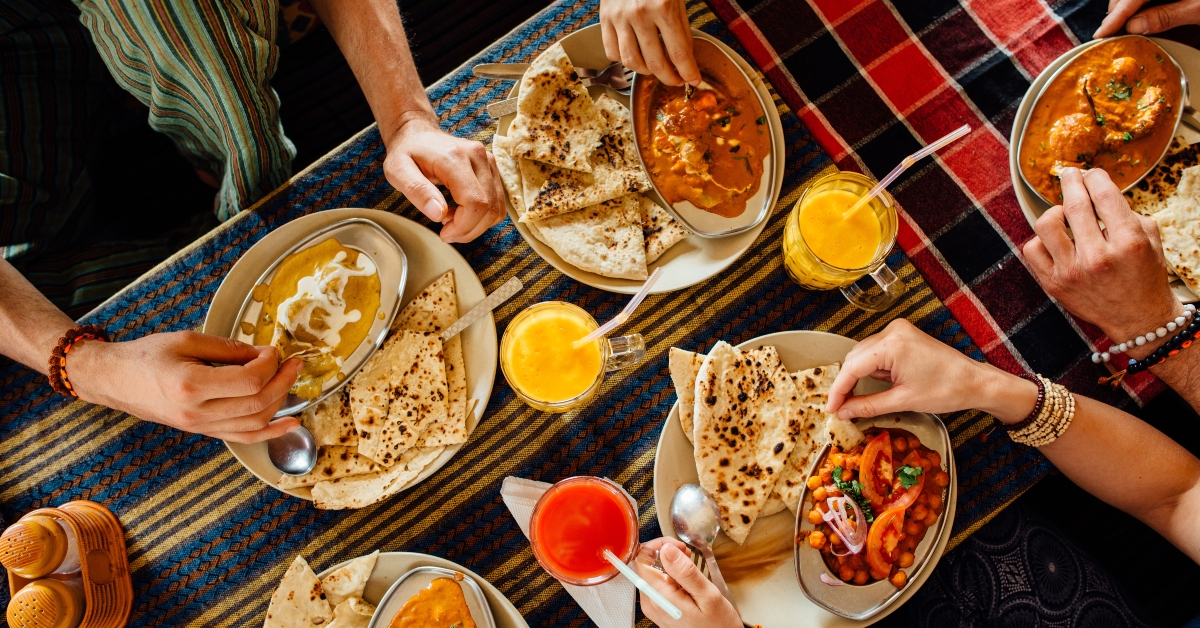 people eating indian meal