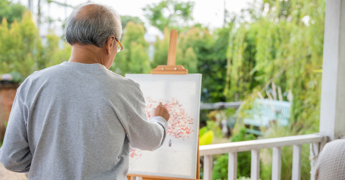 old man painting