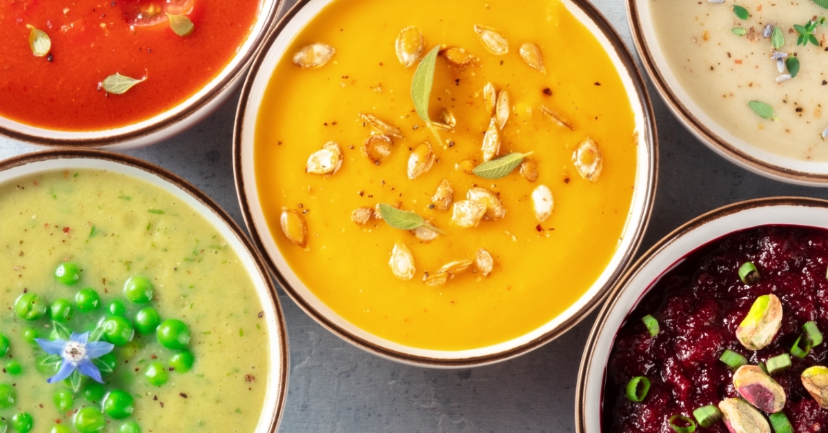 assorted vegan soups on white background