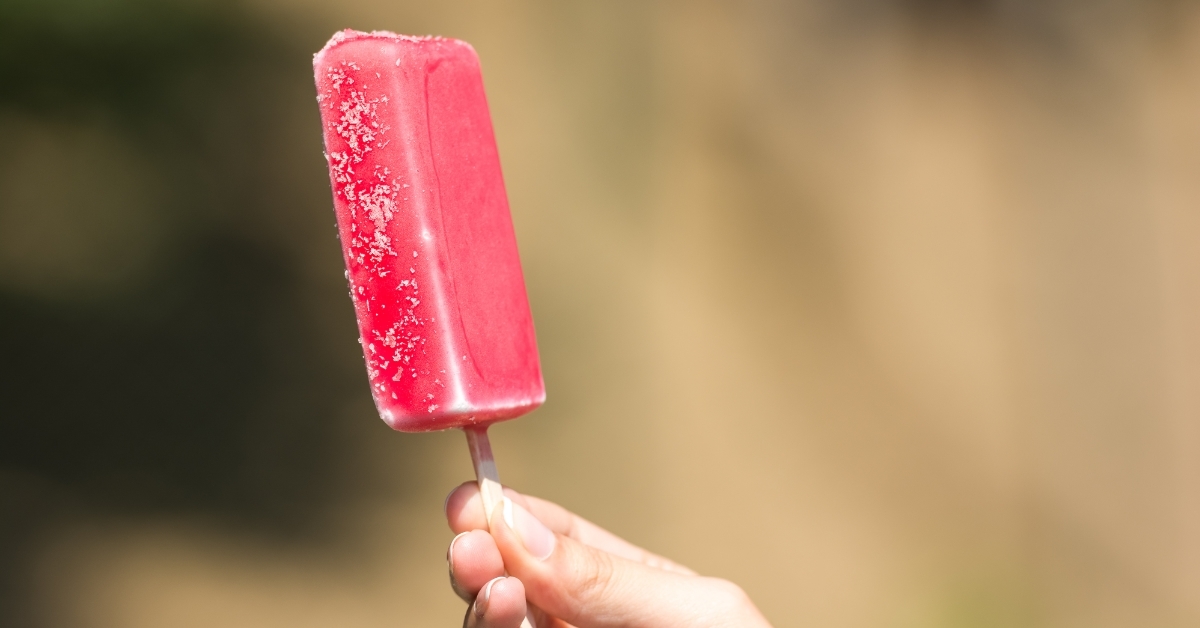 Girl Hand Holding Pink Ice Cream