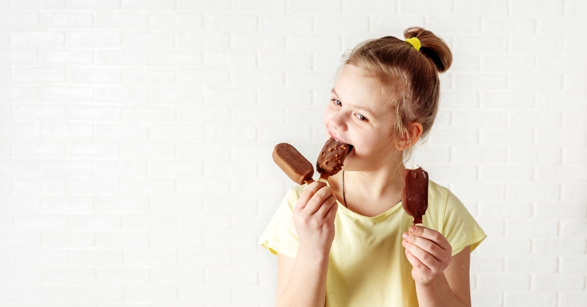 little girl eating ice cream bars