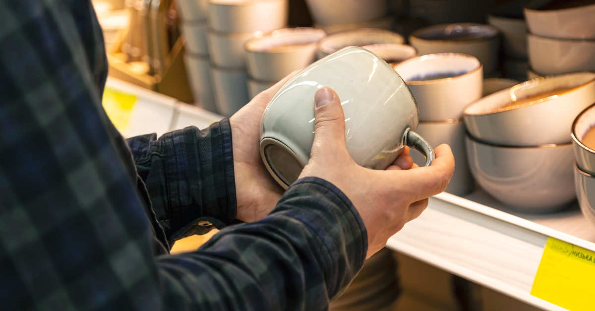 man holding cup