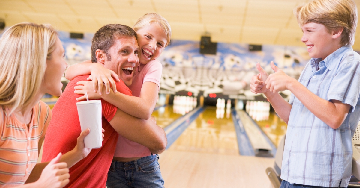 family in bowling alley
