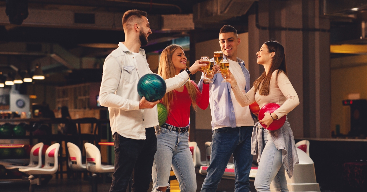  friends toast with a beer 