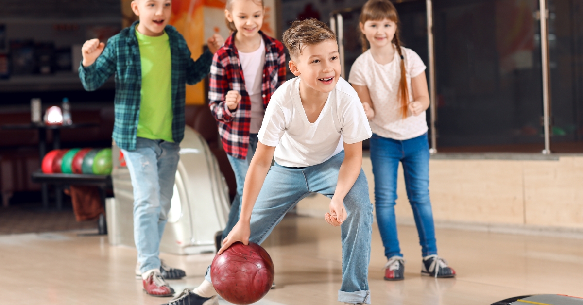 little children playing bowling