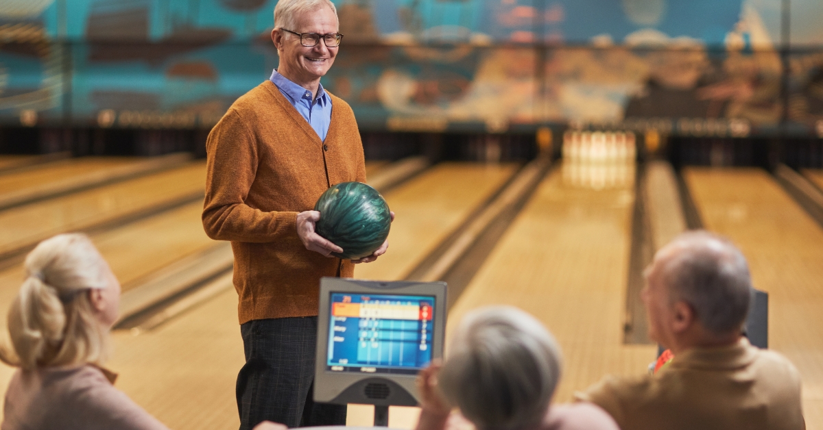 seniors playing bowling together