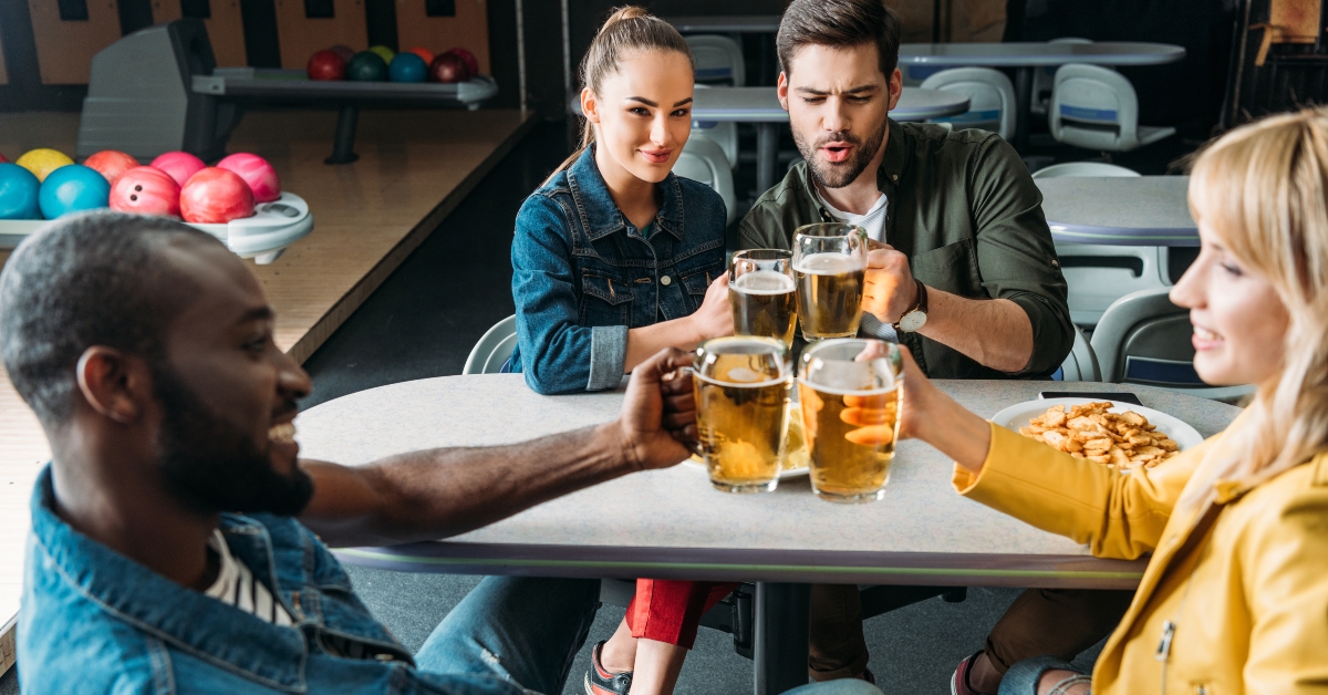 clinking mugs of beer