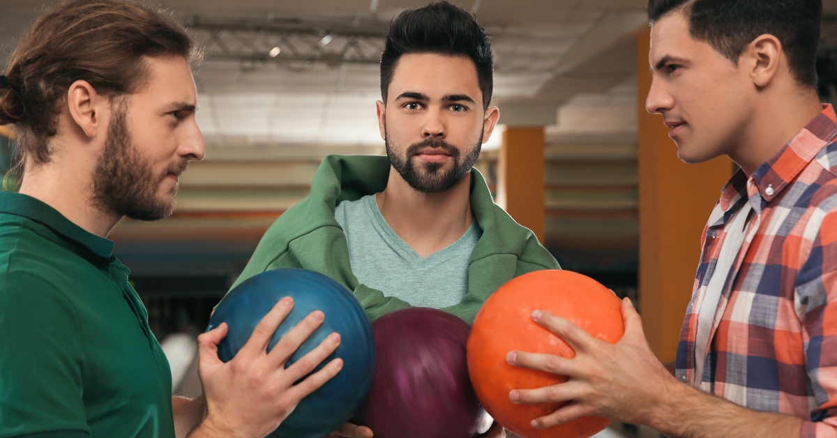 men with balls in bowling club