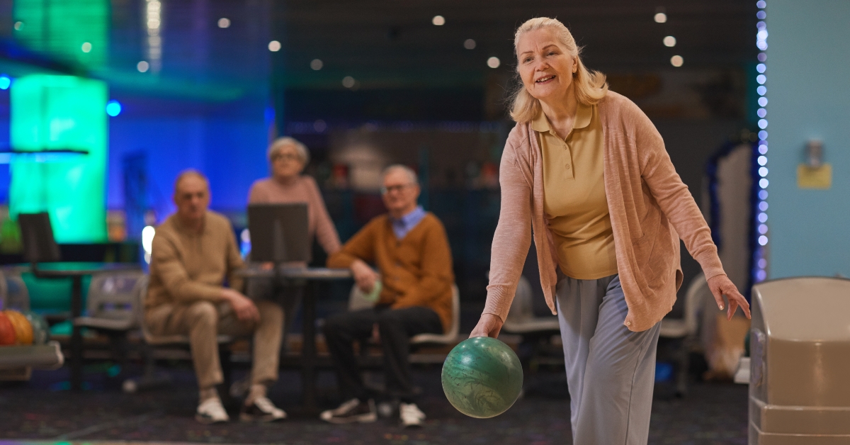 senior woman playing bowling