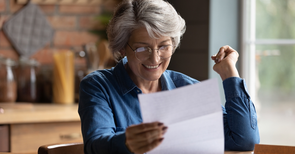 woman triumph reading good news