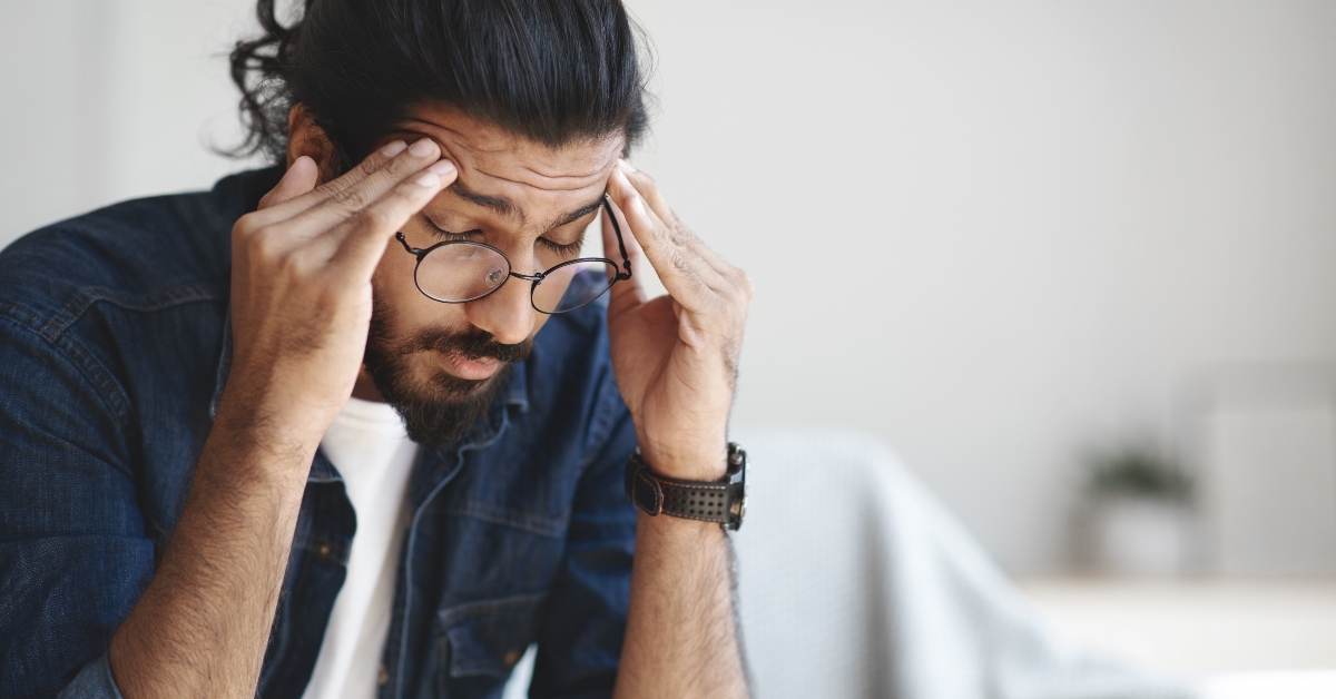 freelancer suffering from headache