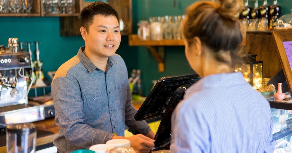  cashier taking customers order