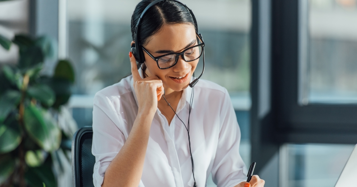 asian translator working online with headset