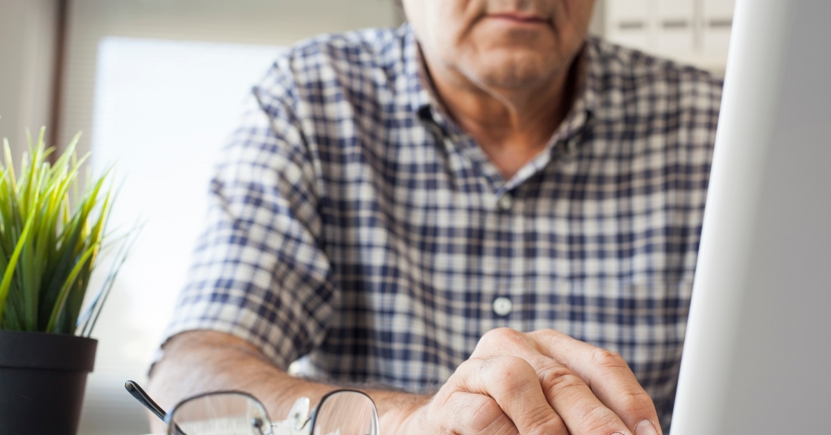 senior man using computer at work