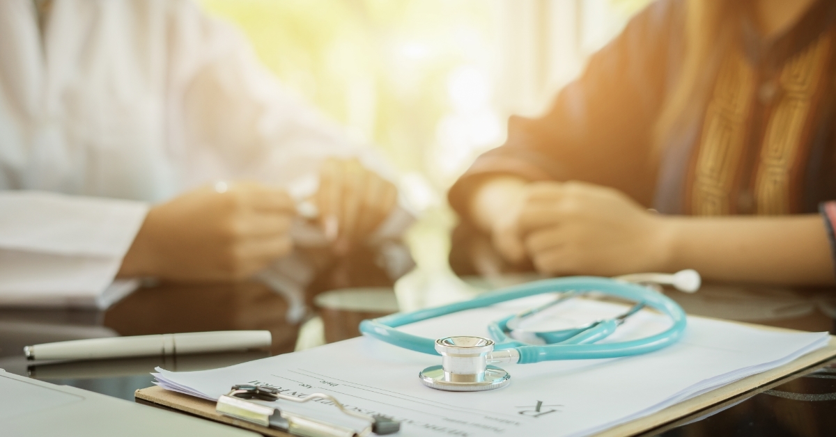 stressed couple consulting doctor at office