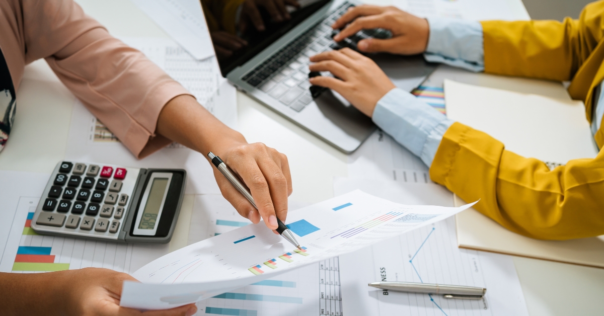 accountant pointing on graph
