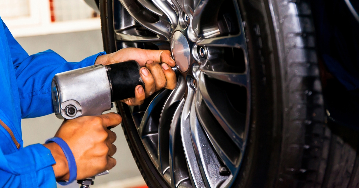 unscrewing car wheel
