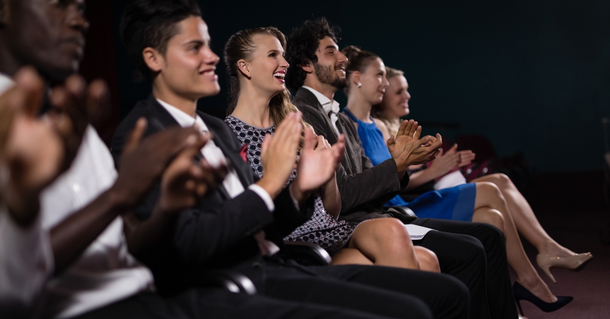 Group of people applauding