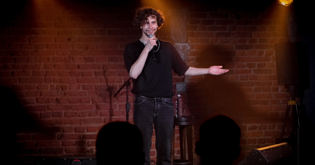 Male comedian performing on stage