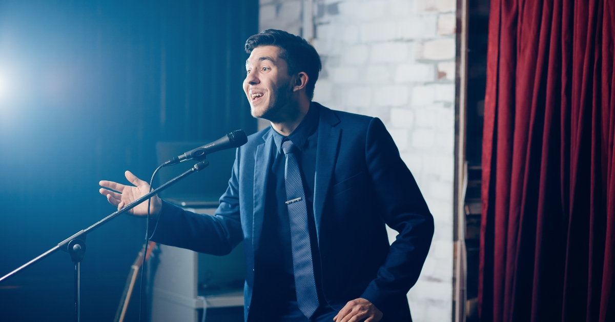 Man sings songs into microphone