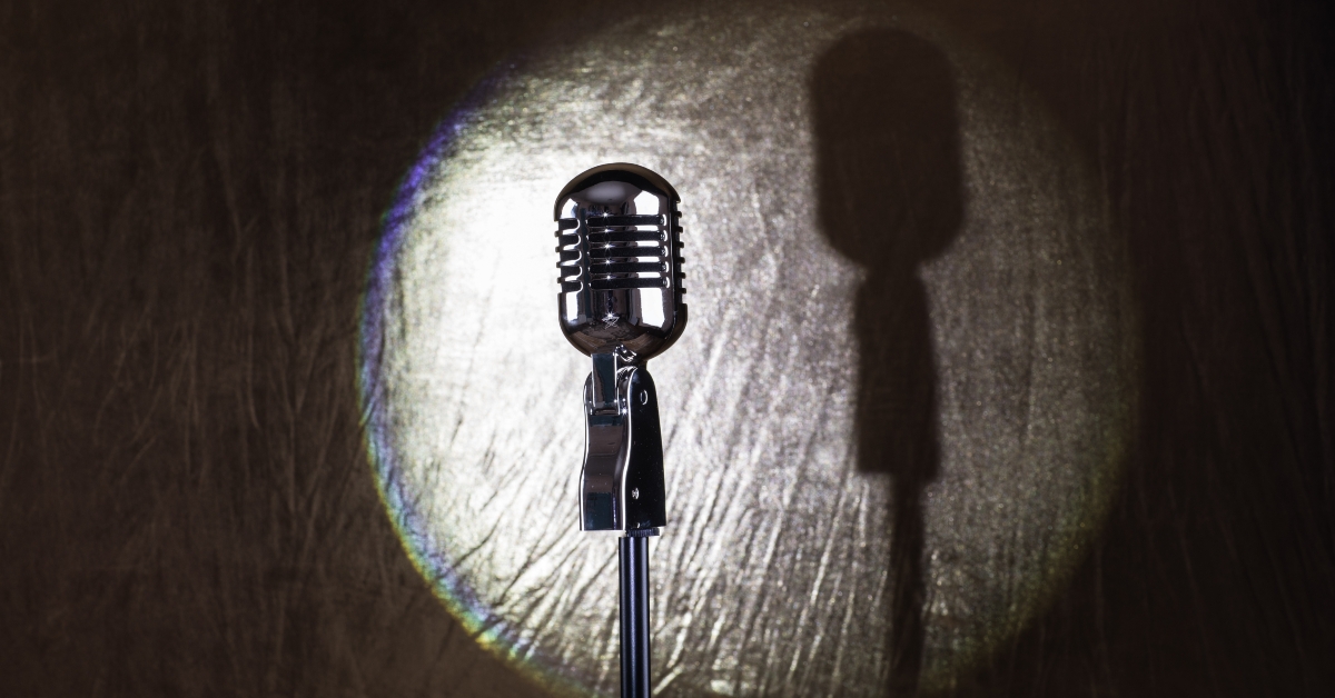 Spotlight retro microphone on stage