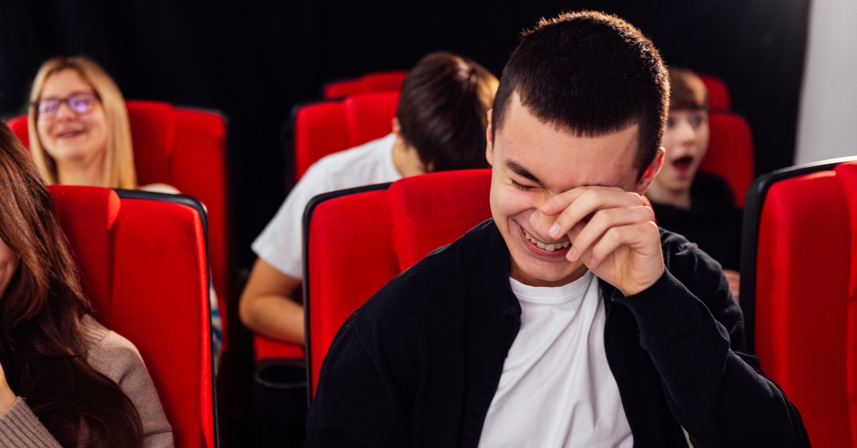 Young people in cinema hall