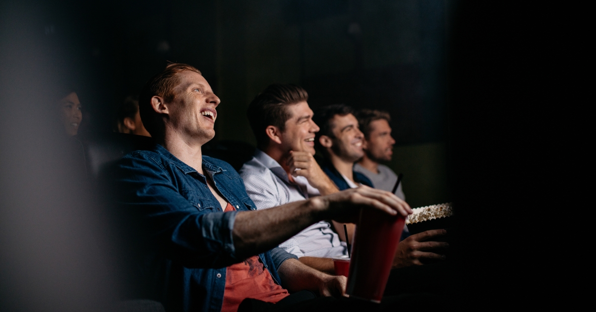 Young people watching comedy movie