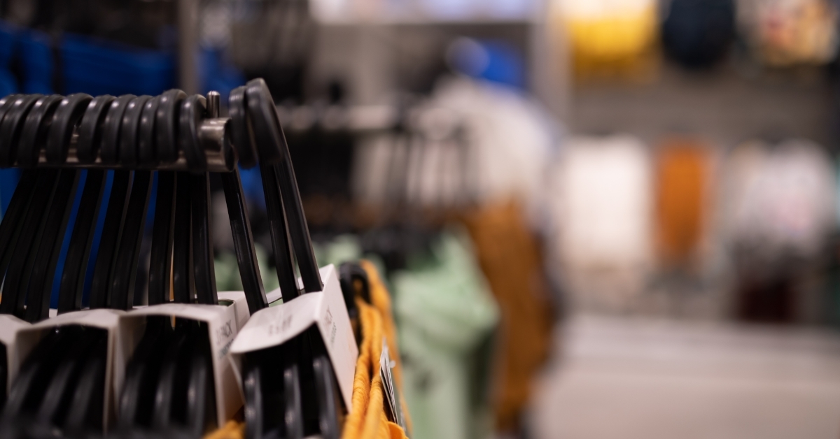 clothes hangers on rack with theft alarm