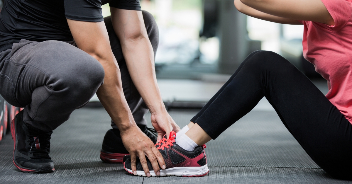 Trainer holding a woman