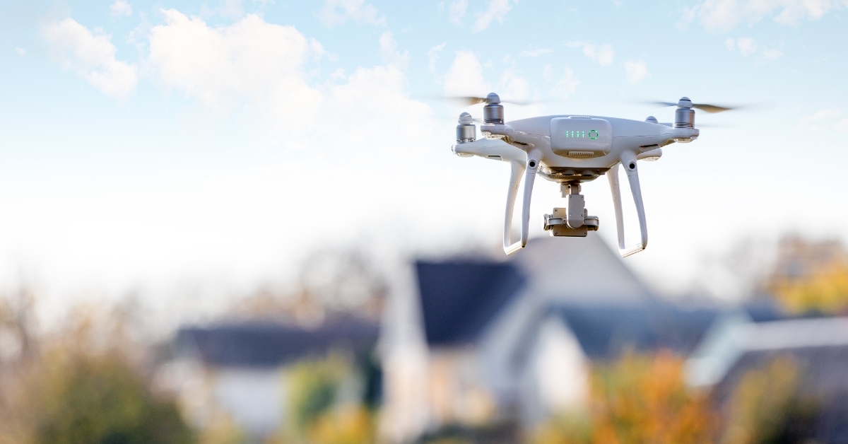 drone flying in front of home