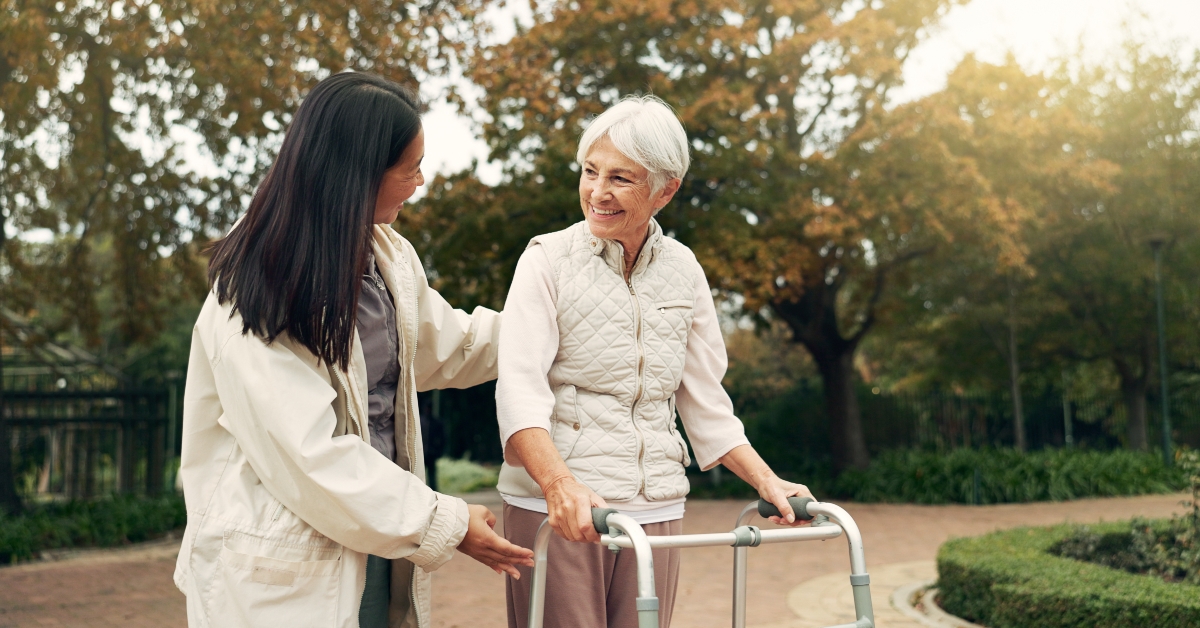 Walker and woman help senior