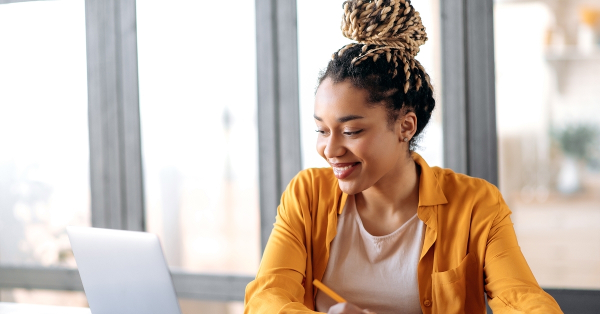 african american woman learning course using laptop