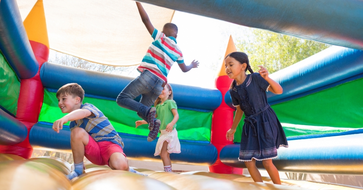 kids enjoying bouncy castle outdoor
