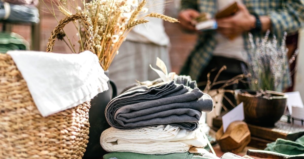 man buying textile samples at designer market