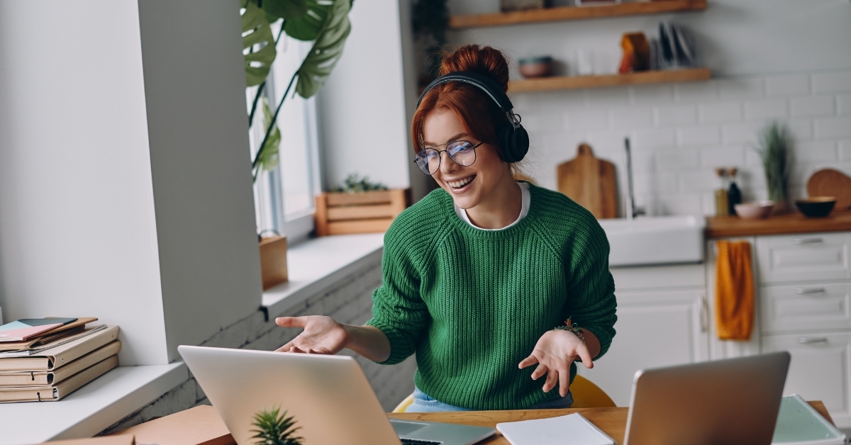 woman working from home attending online webinar 