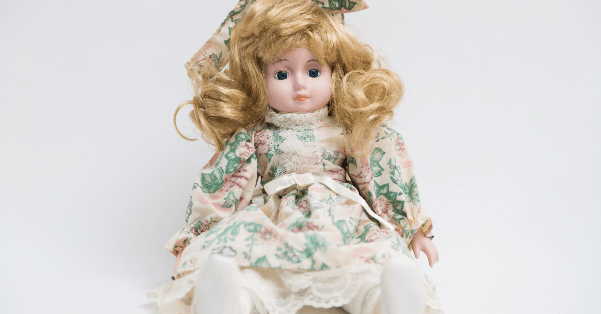 Ceramic porcelain handmade doll with long blond hair and floral dress