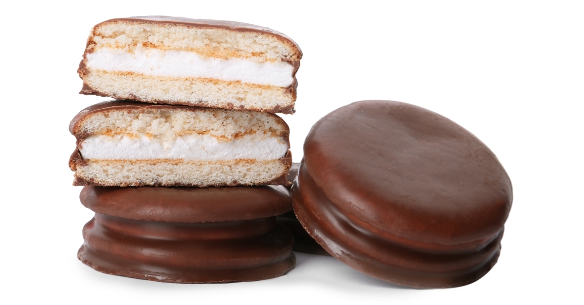 Delicious choco pies on white background