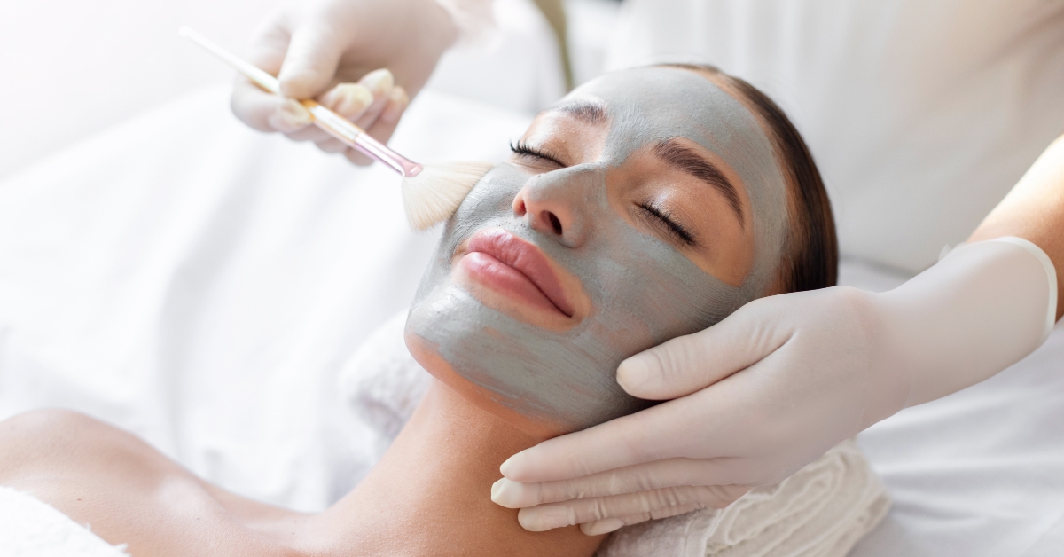 Woman having facial cosmetic treatment