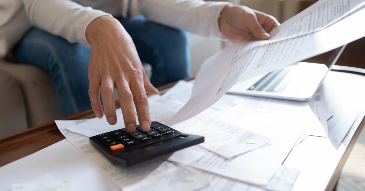 woman calculating bills at home