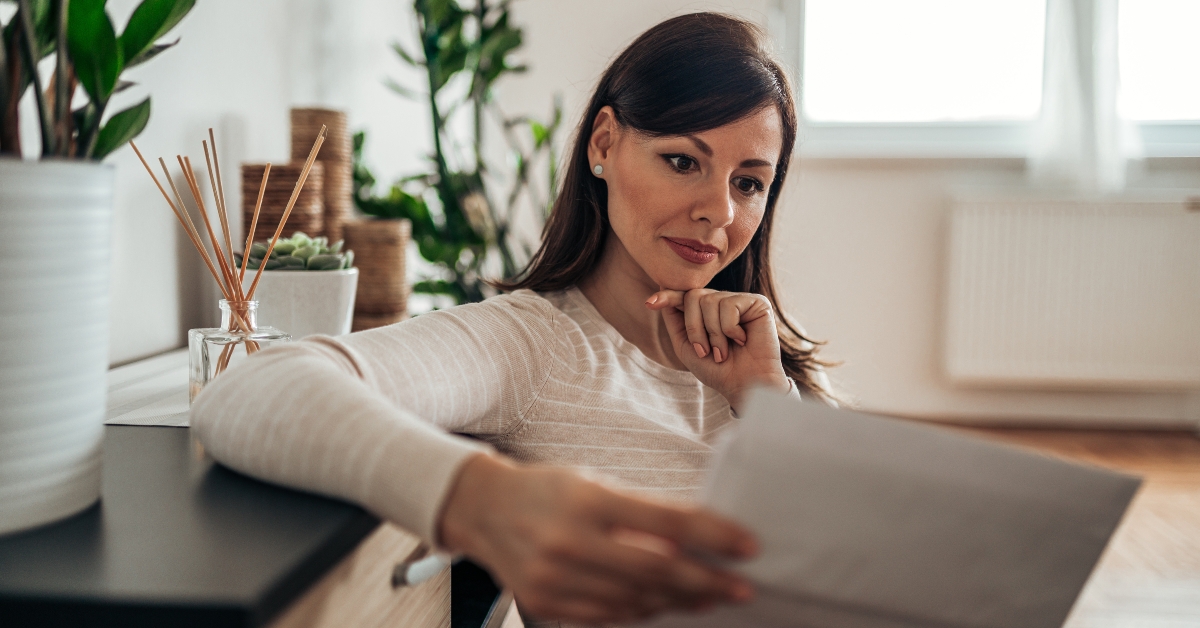 Woman looking at received mail