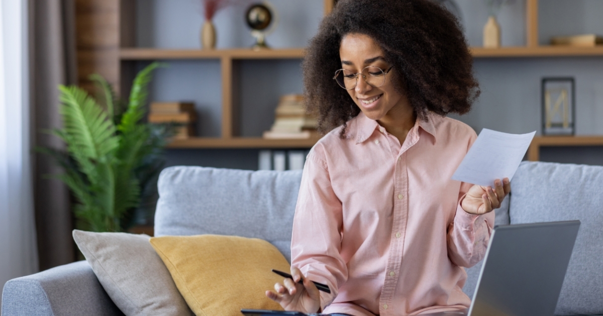 african american woman managing finances at home