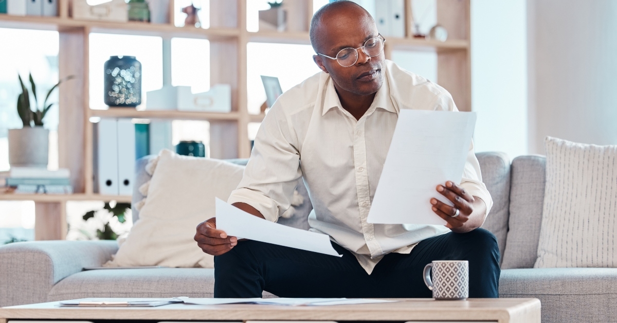 man reading paperwork 