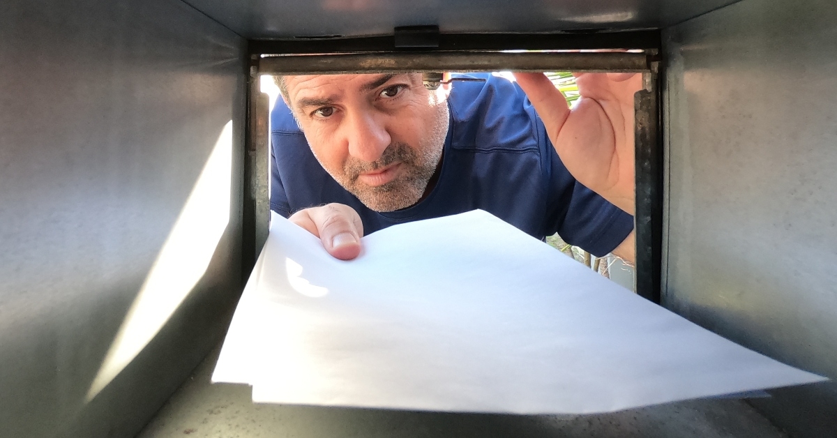 collecting mail from a postal box