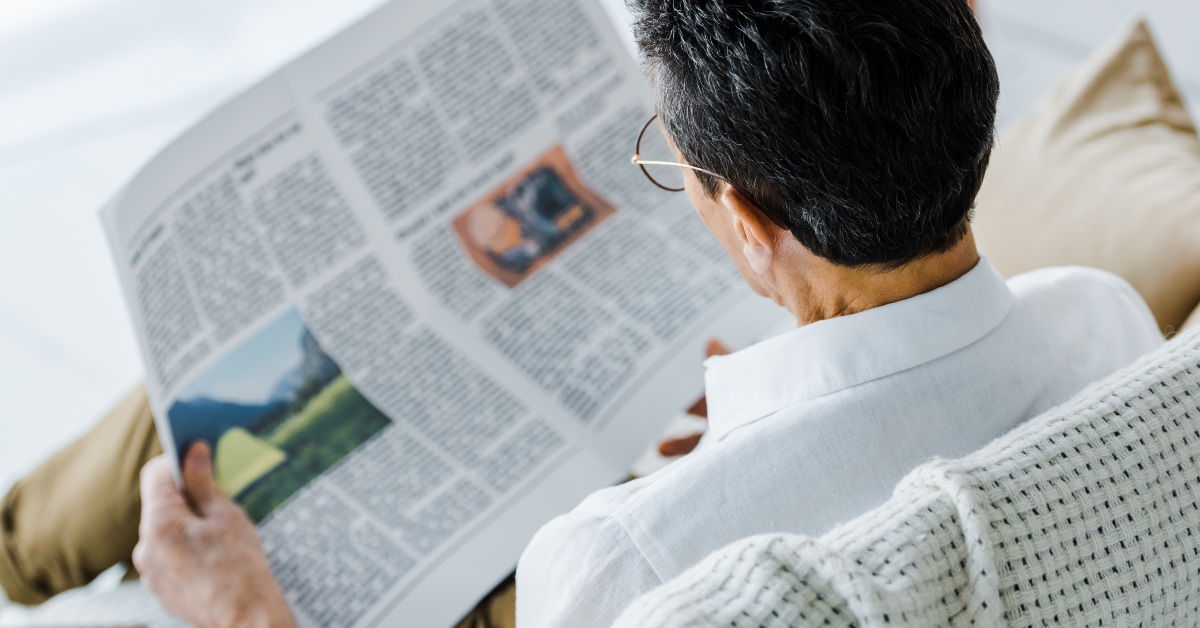 man reading newspaper