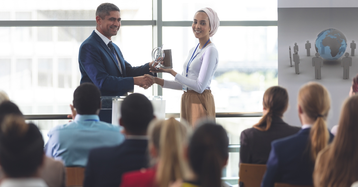 businesswoman receiving award