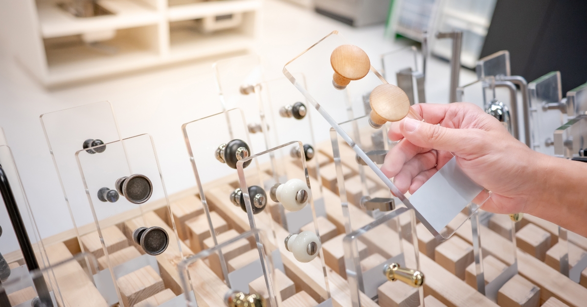 Person choosing cabinet door knob