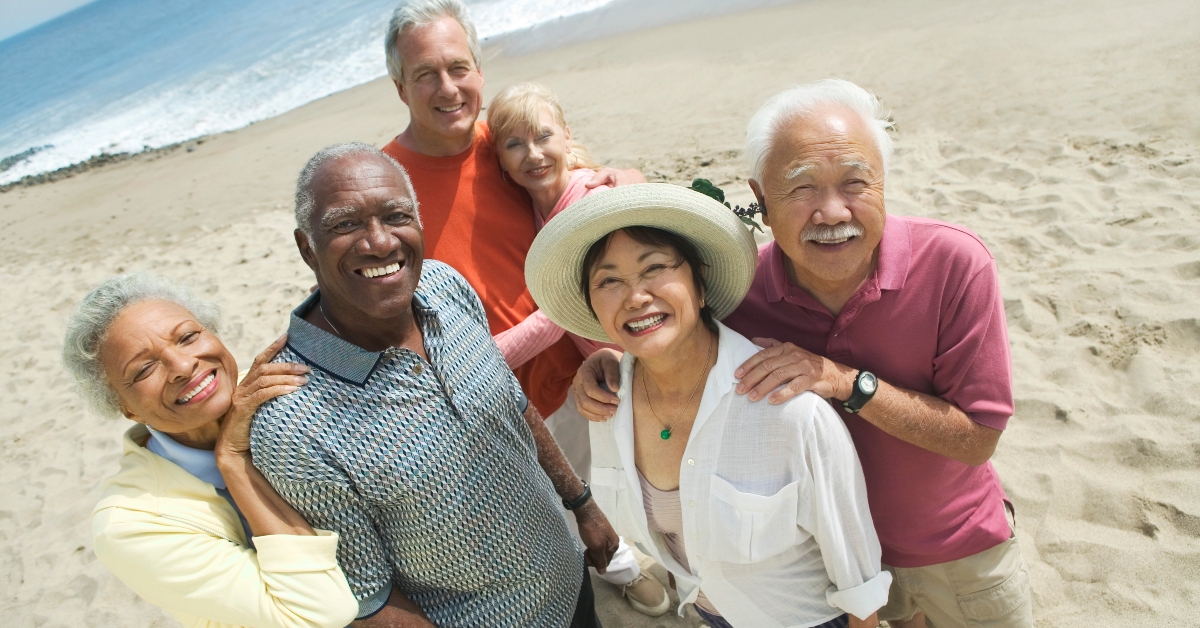  couples smiling on the beach 